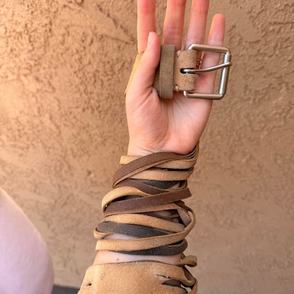 Brown leather wrap belt with silver buckle